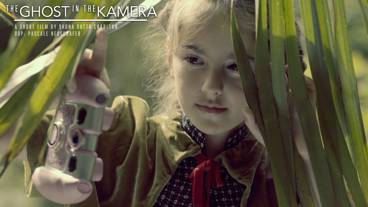 Still from The Ghost in the Kamera — Maya with the camera